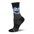 A crew sock featuring a black and white husky running across a light blue background with white mountains. Grey textured mid-foot and black cuff/toe.