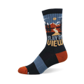 Dark navy crew socks with an outdoor mountain landscape scene, pine trees, and 'Enjoy The View' text. Rust orange toe and heel.