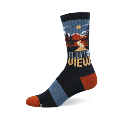 Dark navy crew socks with an outdoor mountain landscape scene, pine trees, and 'Enjoy The View' text. Rust orange toe and heel.