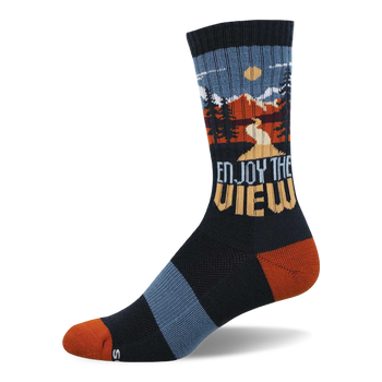 Dark navy crew socks with an outdoor mountain landscape scene, pine trees, and 'Enjoy The View' text. Rust orange toe and heel.