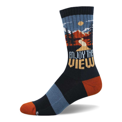 Dark navy crew socks with an outdoor mountain landscape scene, pine trees, and 'Enjoy The View' text. Rust orange toe and heel.