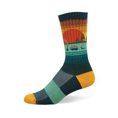 Crew sock with a sunset and Loch Ness Monster design. Orange sun, teal water, dark green trees, yellow heel/toe, checkered foot.