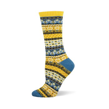 A single crew sock with a yellow and blue Fair Isle pattern, featuring small bee and honeycomb shapes in white and black.