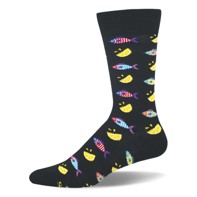 Black crew sock patterned with small colorful striped fishes and bright yellow lemon wedges, featuring a solid black toe.