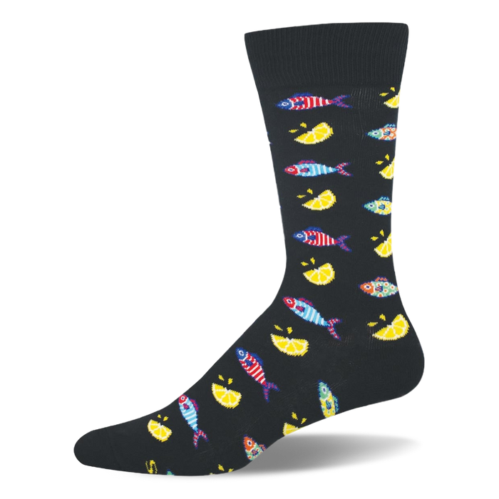 Black crew sock patterned with small colorful striped fishes and bright yellow lemon wedges, featuring a solid black toe. }}