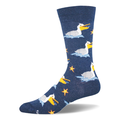 Navy blue crew sock showing a pattern of white pelicans floating on blue waves, holding fish near orange starfish.