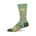 Light green crew sock showing a tropical scene with pink flamingos, a yellow sun, palm trees, and dark olive heel and toe.