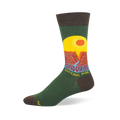 Green crew sock with brown accents featuring a retro Grand Canyon National Park graphic, yellow sun, and red cliffs.