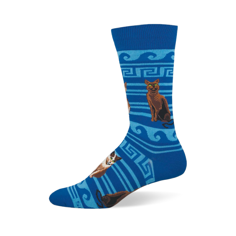 Blue crew sock with brown and calico cats sitting among light blue Greek key patterns, waves, and stripes.