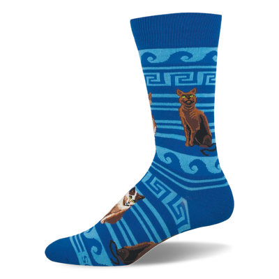 Blue crew sock with brown and calico cats sitting among light blue Greek key patterns, waves, and stripes.
