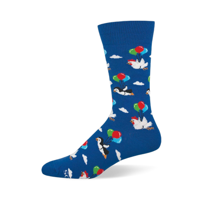 Blue crew sock showing a pattern of penguins and chickens floating among white clouds using bunches of colorful balloons.
