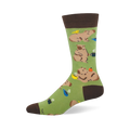 Light green crew sock featuring lounging capybaras, steaming coffee mugs, and a small yellow bird.
