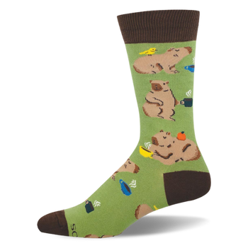 Light green crew sock featuring lounging capybaras, steaming coffee mugs, and a small yellow bird.