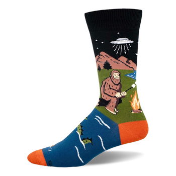 Crew sock with black top, blue foot, and orange heel/toe. Features Bigfoot by a fire, a UFO, and a swimming sea monster.