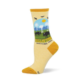 Light yellow socks showing a Yellowstone National Park scene with bison, geysers, pine trees, and mustard yellow accents.