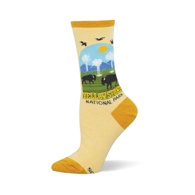 Light yellow socks showing a Yellowstone National Park scene with bison, geysers, pine trees, and mustard yellow accents.