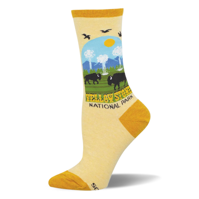 Light yellow socks showing a Yellowstone National Park scene with bison, geysers, pine trees, and mustard yellow accents.