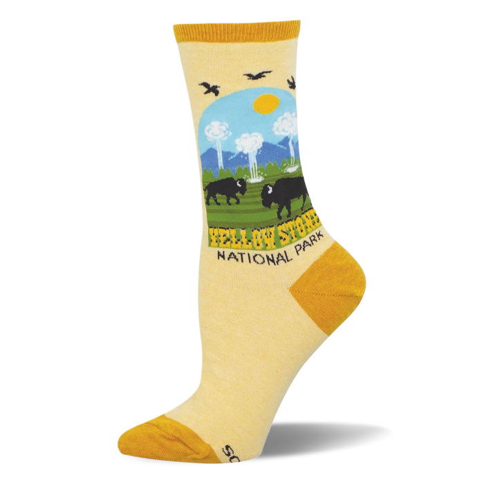 Light yellow socks showing a Yellowstone National Park scene with bison, geysers, pine trees, and mustard yellow accents. }}