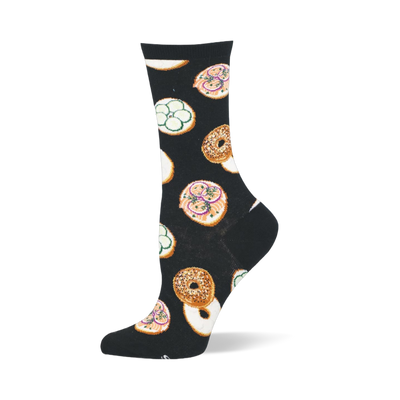Black crew sock featuring a pattern of whole seeded bagels and open-faced bagel halves with pink lox and green cucumbers.