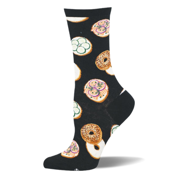 Black crew sock featuring a pattern of whole seeded bagels and open-faced bagel halves with pink lox and green cucumbers.