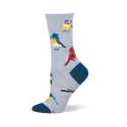 Light blue crew sock with navy heel and toe, featuring a pattern of quirky birds wearing glasses, bucket hats, and cameras.
