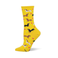 Yellow crew socks featuring brown dachshunds, spotted dachshunds, pink hearts, and green tennis balls.