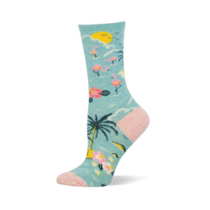 Light blue crew sock with a tropical pattern of pink flamingos, palm trees, and a yellow sun, plus a pink heel and toe.