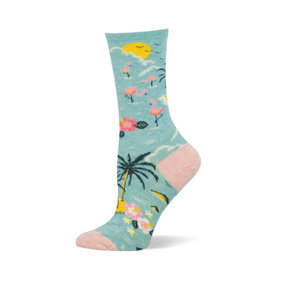 Light blue crew sock with a tropical pattern of pink flamingos, palm trees, and a yellow sun, plus a pink heel and toe.