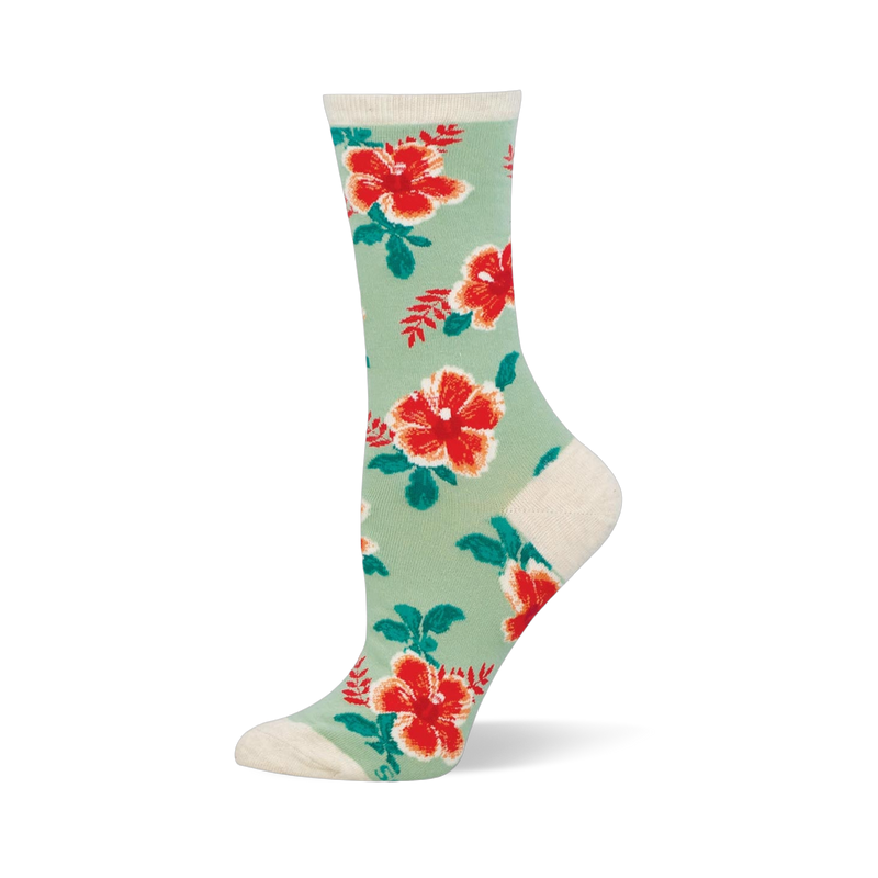 Mint green crew socks covered in red and orange hibiscus flowers with dark green leaves. The cuff and heel are cream colored.
