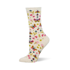 Cream crew socks showing a colorful pattern of pink and yellow butterflies, assorted small flowers, and tiny red ladybugs.