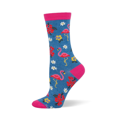 Blue crew socks featuring pink flamingos, colorful tropical flowers, and bright pink accents at the toe, heel, and cuff.