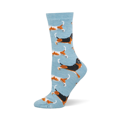 Light blue crew socks featuring a pattern of running basset hounds in classic tricolor and orange and white variations.