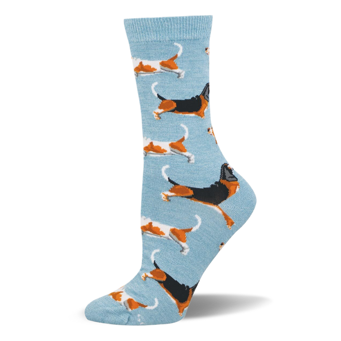 Light blue crew socks featuring a pattern of running basset hounds in classic tricolor and orange and white variations. }}