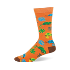 Bright orange crew sock featuring a pattern of blue and green chameleons on branches, tropical leaves, and tiny bugs.
