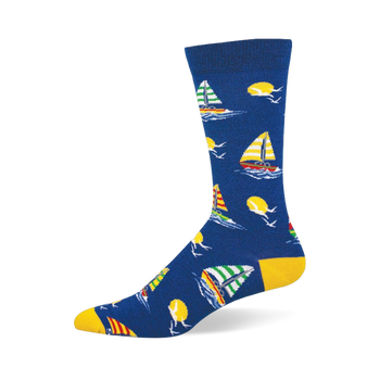 Blue bamboo crew sock featuring colorful striped sailboats, yellow suns, white seagulls, and bright yellow heel and toe.