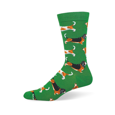 Green crew sock featuring a repeating pattern of long basset hounds in tricolor and brown-and-white coat variations.