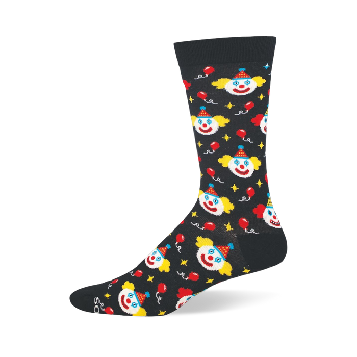 Black bamboo crew sock covered in classic clown faces, floating red balloons, small yellow stars, and solid dark trim.