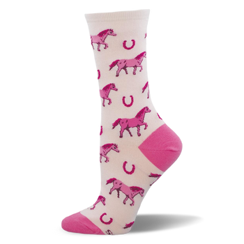 Crew sock with a pale cream background, bright pink pixelated horses, scattered horseshoes, and solid pink heels and toes.