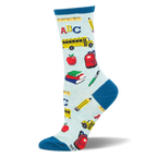 Light blue socks with teal accents, covered in a pattern of school buses, red apples, books, and pencils.