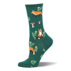 Dark green crew sock with a woodland pattern showing orange foxes, red and white spotted mushrooms, small flowers, and ferns.