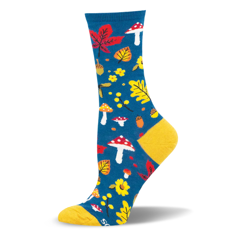 Teal crew sock with a woodland pattern of red spotted mushrooms, yellow leaves, and acorns, featuring a yellow heel and toe.