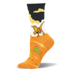 Crew sock featuring a yellow velociraptor walking across a white background above an orange desert with green cacti.