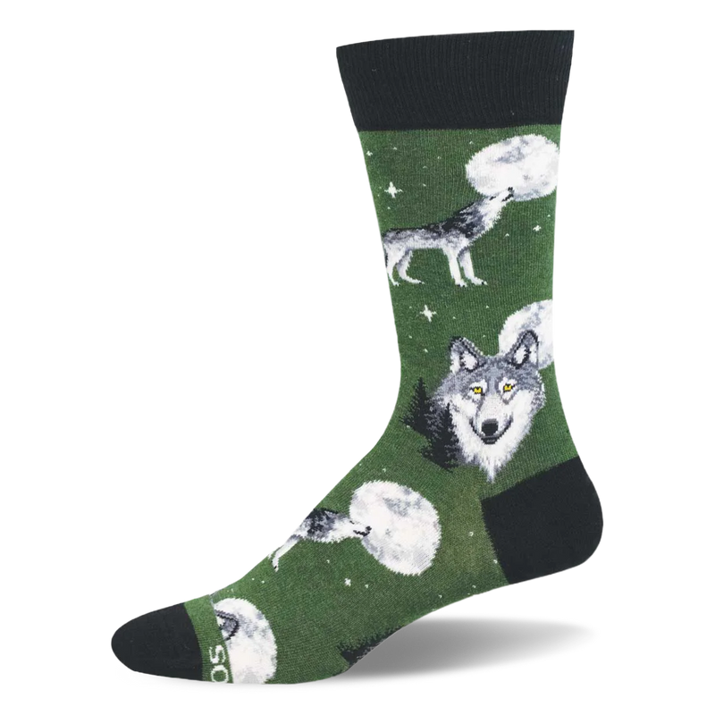 Green crew sock with grey wolves howling at the moon, a large wolf face, tiny stars, and dark black accents on the ends.