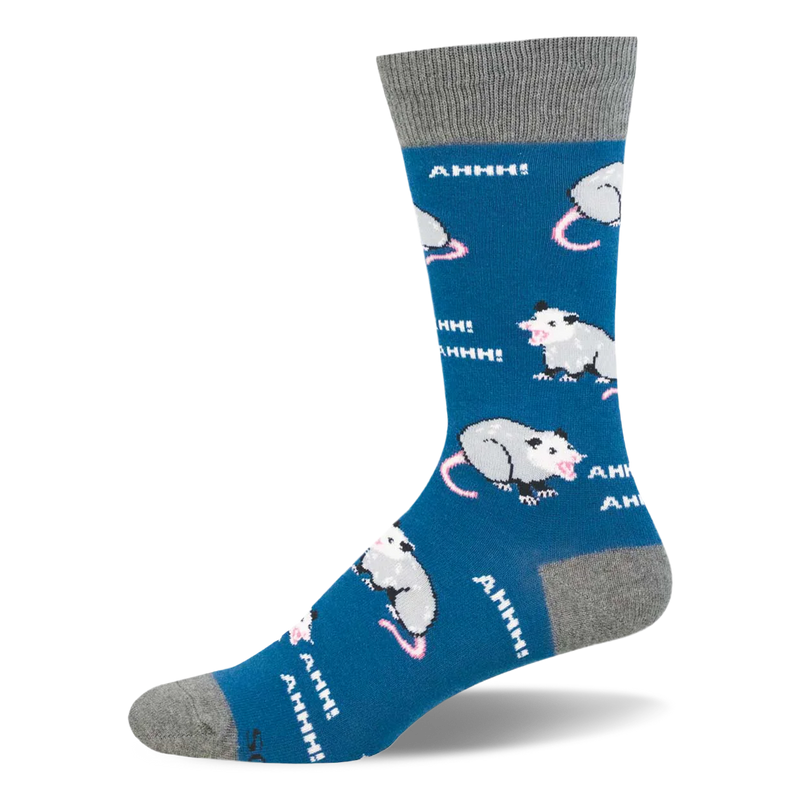 Blue crew sock showing a pattern of yelling possums and white AHHH! text, with a grey cuff and matching grey toe.