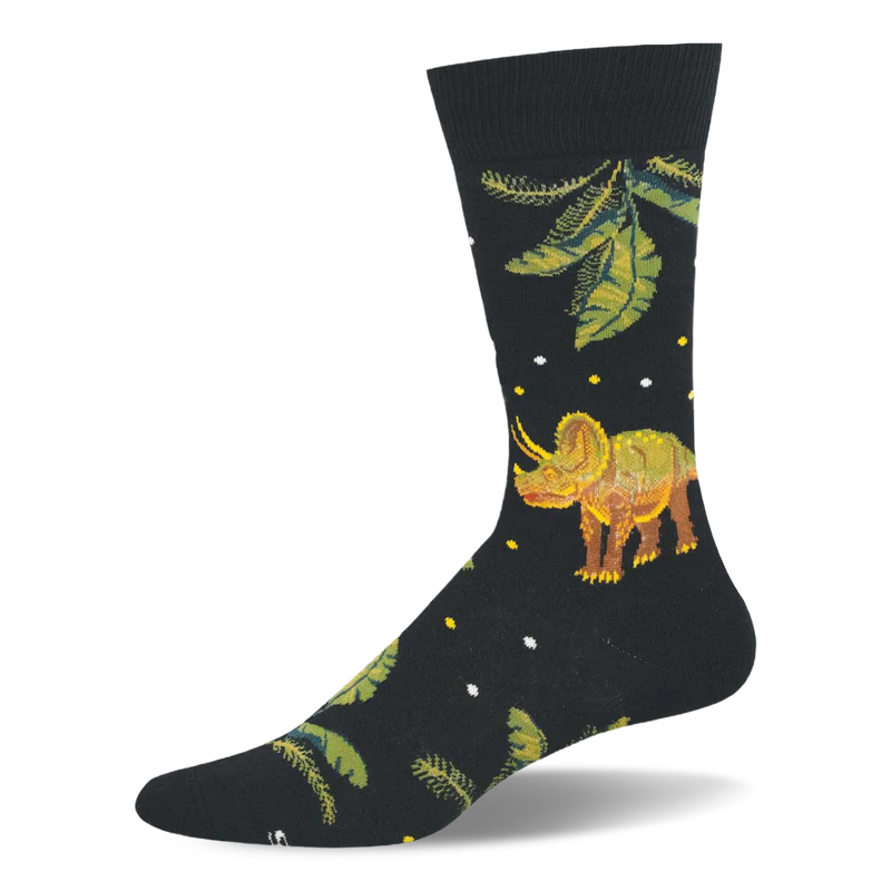 Black crew sock showing a brown and green triceratops standing among giant prehistoric green leaves and tiny white dots.
