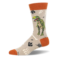 Light tan crew sock with a green T-Rex, pale bones, dark footprints, and rust-orange accents.