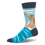 Crew sock showing a colorful flying pteranodon catching a fish over bright blue water and a sandy shore. Navy accents.