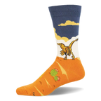 Crew sock with a yellow feathered velociraptor walking on an orange desert landscape with a green cactus under a blue sky.