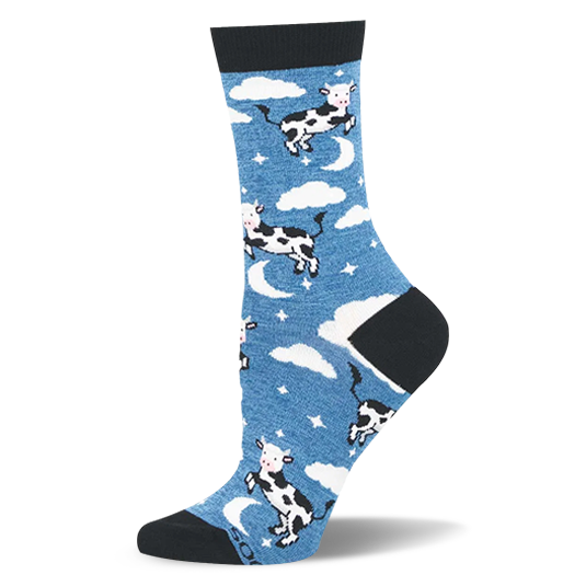 Blue crew sock with black and white cows jumping over crescent moons, fluffy clouds, and stars. Black heel, toe, and cuff.