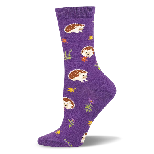 Purple crew sock featuring a pattern of brown hedgehogs, yellow autumn leaves, green ferns, and purple woodland flowers.